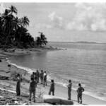 exploring Savo island beach in 1944. Note the naval battle debris.