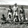 MARTIN WITH SCOUTS NEAR AIRFIELD. THE SCOUT SITTING FAR RIGHT IS CHAKU. MARTIN SAID HE WAS SUSPECTED OF KILLING A WHITE MAN,BUT THE MATTER WAS PUT ASIDE.MARTIN SAID HE MET CHAKU AGAIN AT THE 50TH ANNIVERSARY IN 1992 AND HE (CHAKU) MADE HIMSELF SCARCE.